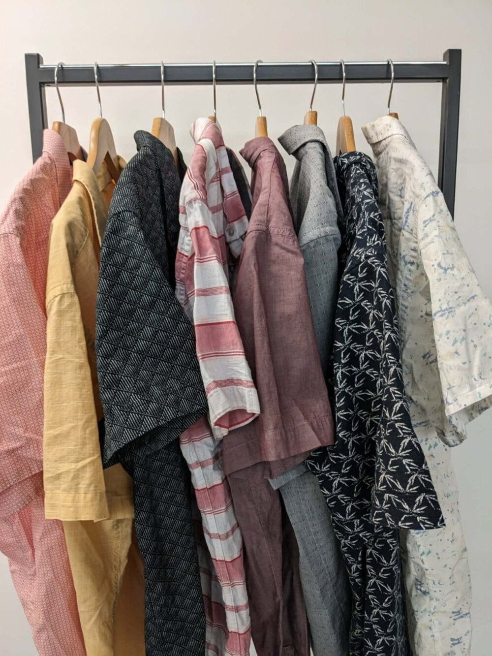 Assortment of mens button down shirts.